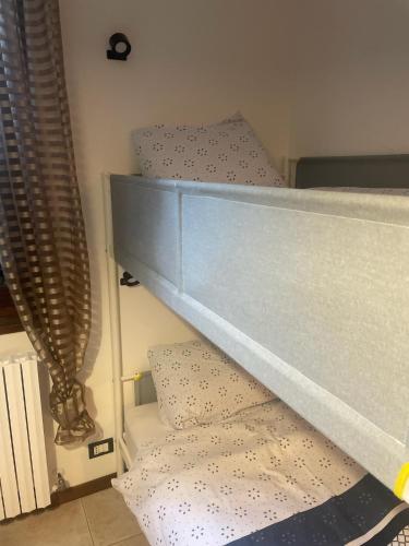 a bunk bed with pillows on top of it at Villa Vinea Prisca B&B in Cenate Sotto