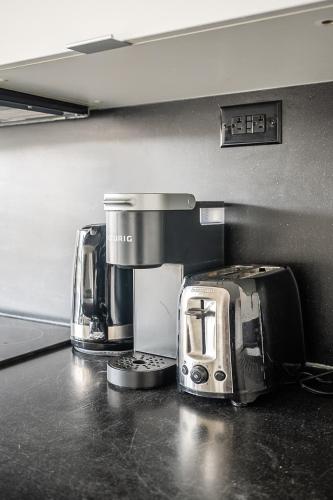 two coffee machines on a counter in a kitchen at Apartment in Downtown Toronto in Toronto