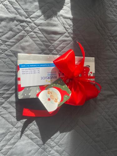 a package of santa claus candy with a red ribbon at Riverside Nis in Niš