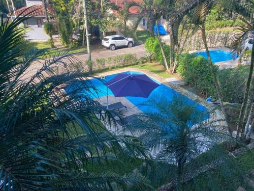 an overhead view of a pool with an umbrella at Casa Park Imperial 
