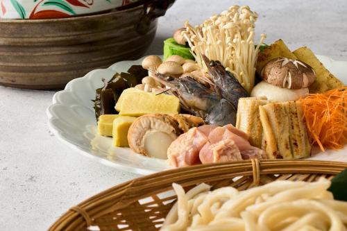 a plate of food with noodles and other foods at Yumura Onsen MIDORIYA in Shinonsen