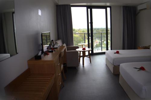 Postel nebo postele na pokoji v ubytování Nalagi Hotel