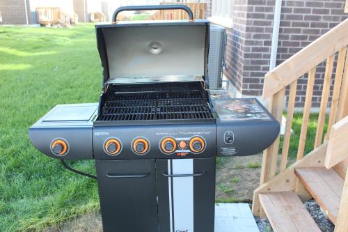 a bbq grill sitting on a porch at Detached New Modern House In South Barrie - Built H plus ME Technology in Barrie