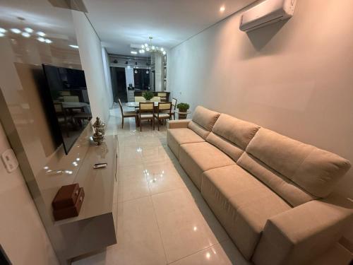 a living room with a couch and a table at Paraíso do Oeste in Luis Eduardo Magalhaes