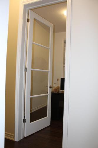 a door with a glass window in a room at Detached New Modern House In South Barrie - Built H plus ME Technology in Barrie