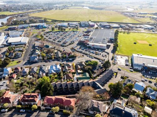 an aerial view of a town with a parking lot at Elphin Serviced Apartments in Launceston
