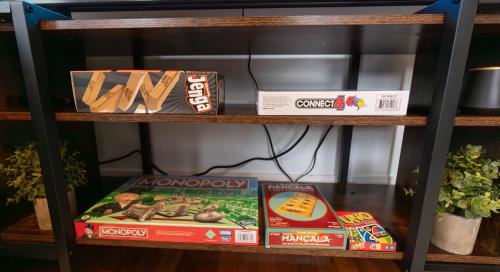 a shelf with boxes of food on it at 4BDR|Tufts|Train|Free Parking in Winter Hill