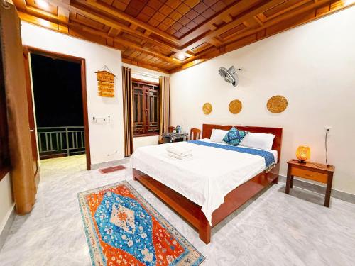 a bedroom with a bed in a room at The Hill Villas in Phong Nha