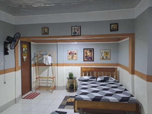 Ένα ή περισσότερα κρεβάτια σε δωμάτιο στο Dalinda's Homestay