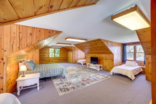 a living room with a couch and a fireplace at Live Large on Saddle Lake! Family Home with Dock in Grand Junction