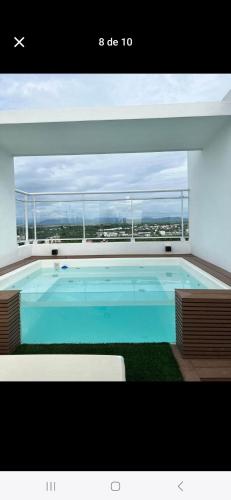 a large swimming pool on top of a building at Estela in Santo Domingo