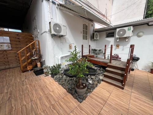a balcony with a bench and potted plants at Le Calypso - Residence Terre et Truffes in Le Lamentin