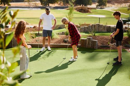 a group of people playing a game of golf at Country Club Tasmania in Launceston