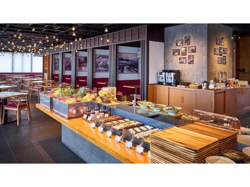 a buffet line with a lot of food in a restaurant at Skye Niseko - Vacation STAY 30728v in Niseko