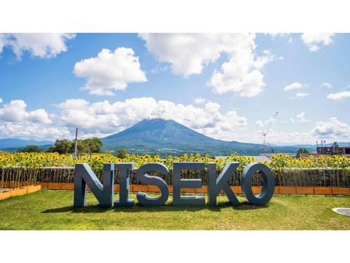 a sign that says mexico in front of a field of flowers at Skye Niseko - Vacation STAY 41529v in Niseko