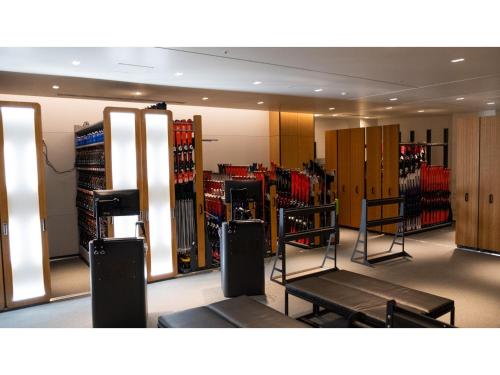 a room with a gym with a lot of equipment at Skye Niseko - Vacation STAY 41511v in Niseko
