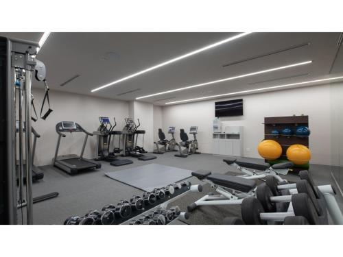 a gym with lots of exercise equipment in a room at Skye Niseko - Vacation STAY 41511v in Niseko