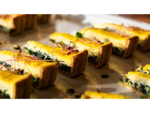 a bunch of bread with cheese and herbs on it at Skye Niseko - Vacation STAY 70563v in Niseko