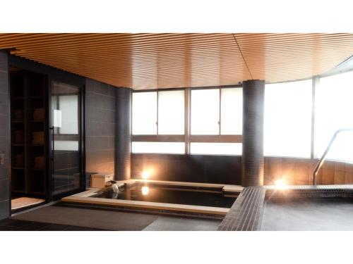a bathroom with a sink and some windows at Skye Niseko - Vacation STAY 70578v in Niseko