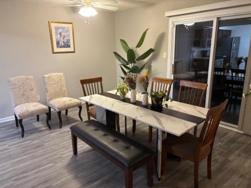 a dining room with a table and chairs at Hampton cozy house near Langley AFB in Hampton