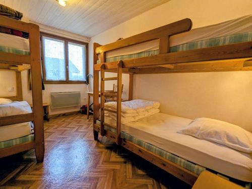 a room with two bunk beds in a house at Gîte Confortable au Cœur des Vosges - Animaux Acceptés - FR-1-589-839 in Le Ménil