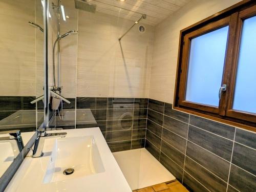 a bathroom with a sink and a shower at Gîte Confortable au Cœur des Vosges - Animaux Acceptés - FR-1-589-839 in Le Ménil