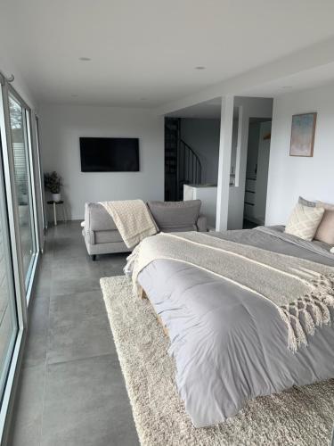 Ένα ή περισσότερα κρεβάτια σε δωμάτιο στο Guest house - Ocean views