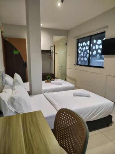 Кровать или кровати в номере Swing & Pillows - Chow Kit Road, Kuala Lumpur