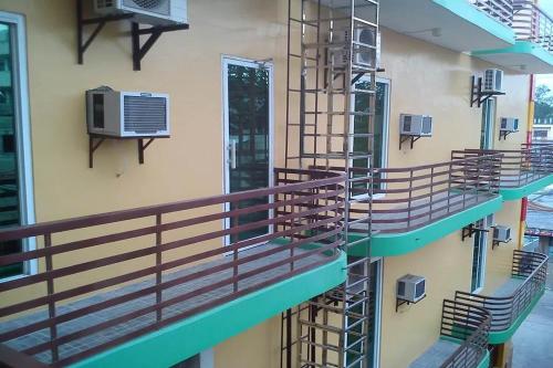 a set of stairs in a building with an air conditioner at Taj Hotel Tuguegarao in Tuguegarao City
