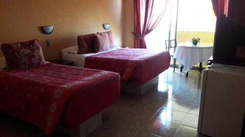 Postel nebo postele na pokoji v ubytování Hotel Costa Pacifico