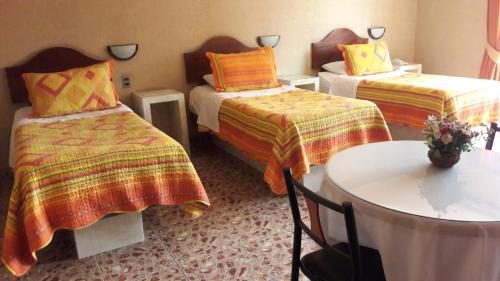 Postel nebo postele na pokoji v ubytování Hotel Costa Pacifico