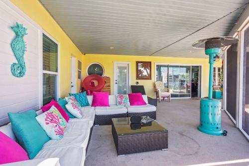 a living room with a couch and a table at The Mermaid on the Cotee River in Port Richey
