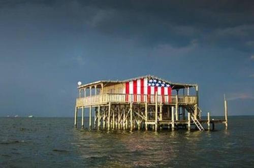 a house on a pier in the water at The Mermaid on the Cotee River in Port Richey