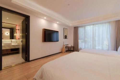 Katil atau katil-katil dalam bilik di Xishang Yunjian Holiday Hotel