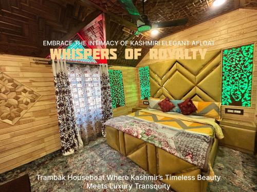 a bedroom with a bed in a room with wooden walls at Houseboat Trambak in Srinagar