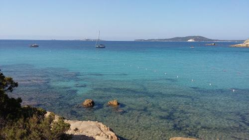 a large body of water with rocks in it at Hotel Domu Incantada in Muravera