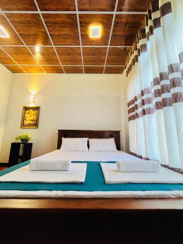 Postel nebo postele na pokoji v ubytování Chamikara Homestay