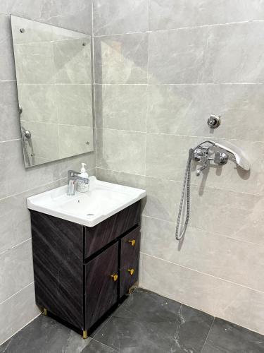 a bathroom with a sink and a shower at Hotel Sai Inn in Amritsar