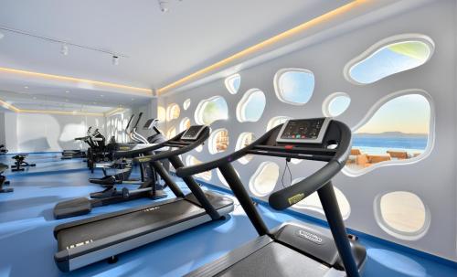 a gym with treadmills and elliptical machines at Anax Resort and Spa in Agios Ioannis Mykonos