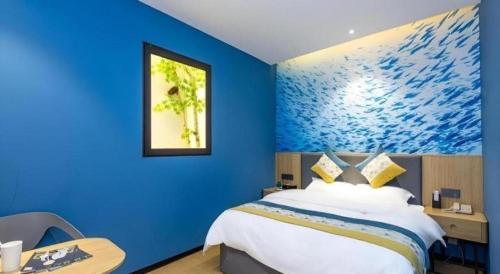 Ένα ή περισσότερα κρεβάτια σε δωμάτιο στο GreenTree Inn Express Fuzhou Minhou County Mindu Custom Park