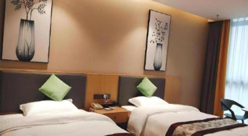Ένα ή περισσότερα κρεβάτια σε δωμάτιο στο GreenTree Inn Express Fuzhou Minhou County Mindu Custom Park