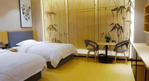 Ένα ή περισσότερα κρεβάτια σε δωμάτιο στο GreenTree Inn Express Fuzhou Minhou County Mindu Custom Park