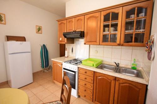 A kitchen or kitchenette at Apartments&Rooms Miro Sea view - near Beach
