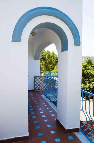 an archway on the balcony of a house at Aparthotel Villa Marinù in Ischia