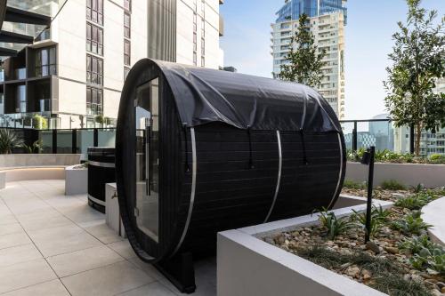 a building with a tarp on it in a city at Urban Rest City Road in Melbourne