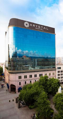 a large building with a sign on the side of it at Krystal Monterrey in Monterrey