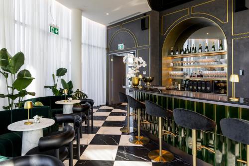 a restaurant with a black and white checkered floor at Urban Rest City Road in Melbourne