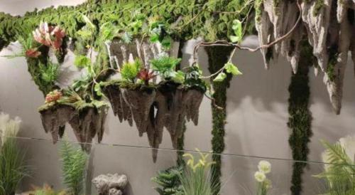 a group of plants hanging on a wall at Atour Hotel Jinan Tangyan Century Avenue in Jinan