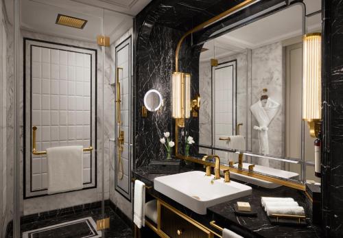 a bathroom with a sink and a mirror at Fairmont Mumbai in Mumbai