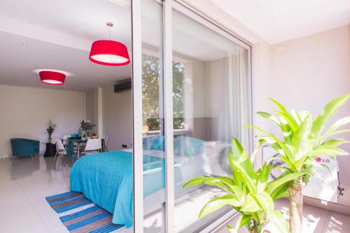 a bedroom with a bed and a living room at Soho Luxury Suites in Buenos Aires